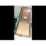 A silver photo frame and one other