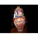 A 30cm high Imari vase and cover