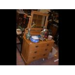 A satin walnut dressing chest with mirror to back