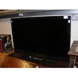 A Sony flat screen TV with remote