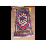 An antique prayer mat with geometric border