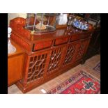 A Middle Eastern style sideboard with drawers to t