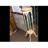 A two tier plant stand with barley twist support t