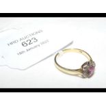 An 18ct diamond and ruby cluster ring - size O (ap