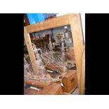 A large modern pine framed wall mirror - 90cm x 1