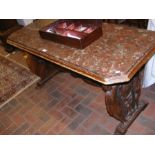 A Continental marble top library table with carved