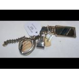 A silver frame miniature mirror, money clip and mi