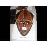 An old carved African Lwalwa mask - 26cms