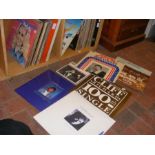 A stock of vinyl records, including The Beach Boys