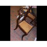 A set of four Regency dining chairs with cane work