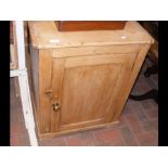 An antique pine cupboard