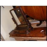 A mahogany toilet mirror, stool top, etc.