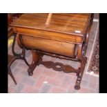 A 19th century rosewood worktable with shaped supp