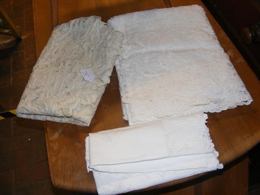 Three assorted antique table cloths