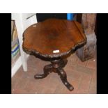 A 19th century shaped wine table