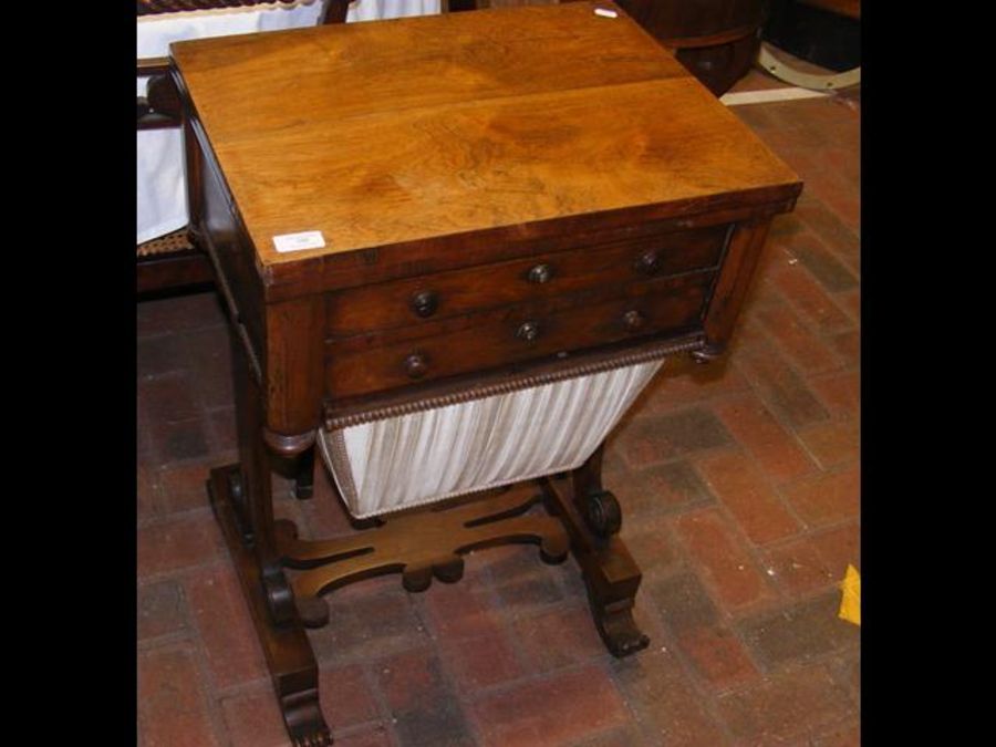 A Regency rosewood work table with fold over games