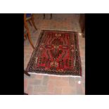 A small Middle Eastern rug with geometric border -