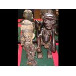 A 38cm high old carved African tribal figure, toge