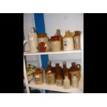 Various stoneware cider flasks, together with othe