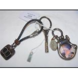 A silver 'car radiator' keyring together with two