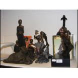 A collection of bronzed figures, including mermaid