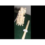 An 11cm high carved ivory figure together with an