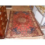 A Bakhtiari rug with red ground and geometric bord