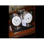 An antique desk clock barometer/thermometer set wi