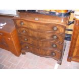 A mahogany serpentine fronted chest of four long d