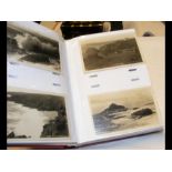 An album bearing vintage monochrome postcards