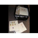 A box containing collectable stamps on sheets