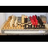 An Anglo Indian - Vizagapatam - ebony and ivory veneered chess and backgammon board, together with a