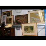 A medley of framed and glazed pictures, including
