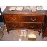 An antique chest of two long drawers