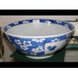 A 30cm diameter antique Oriental blue and white bo