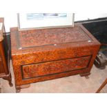 A carved oriental blanket chest standing on lion p