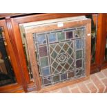An old stained glass window in original frame