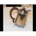 A silver water jug with Birmingham hallmark