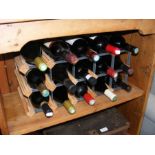 Fifteen bottles of red wine in wine rack
