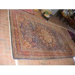 An Indian antique carpet with geometric border and