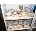 An assortment of antique serving ware, including B