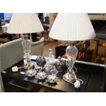 A pair of glass and chrome table lamps together wi