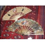 A decorative antique fan with pierced decoration a