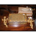 Two Anglo-Indian hardwood boxes, together with two gilt cherubs