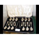 A boxed set of twelve silver teaspoons with sugar