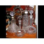 A silver mounted decanter, claret jug etc.