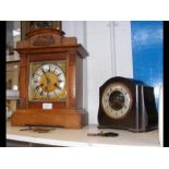 A Smiths Bakelite mantel clock, together with an o