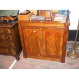 A 19th century mahogany two door cabinet with reed