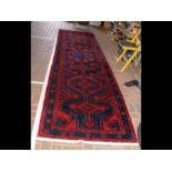 A long Middle Eastern style runner with geometric