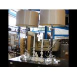 A pair of chrome and glass table lamps together wi